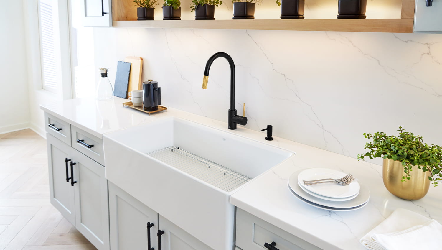 DXV black faucet and white sink